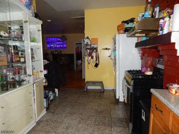 a kitchen with a stove and a refrigerator