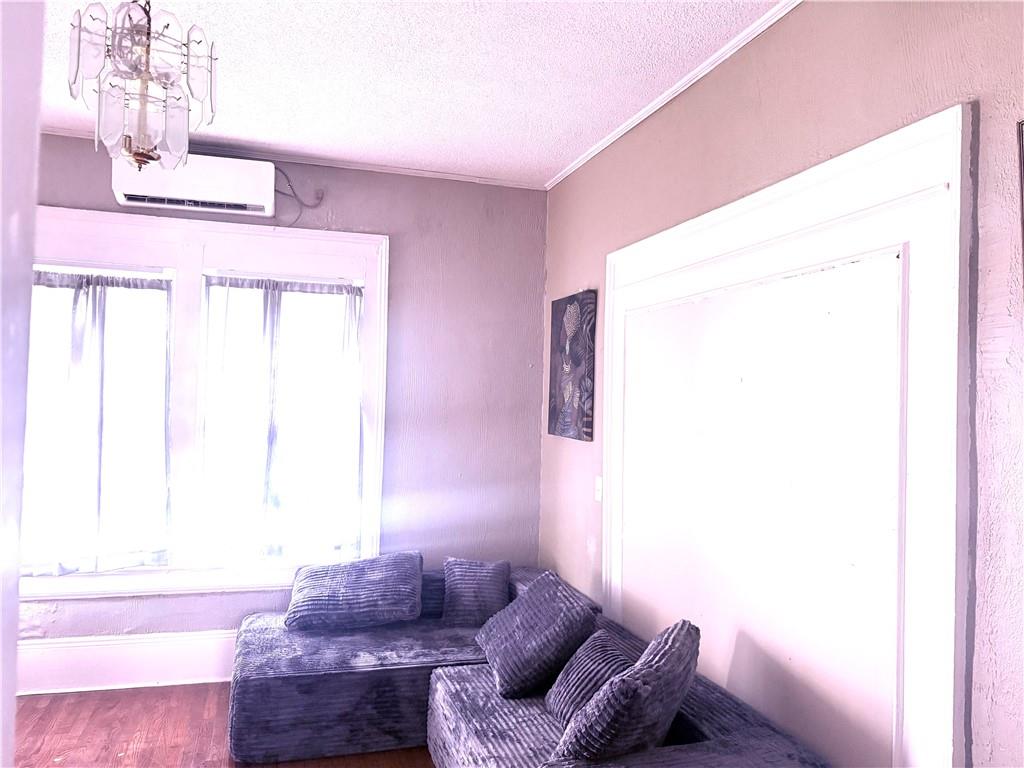 343 Cairo Street Northwest Atlanta, GA 30314 - Photo 12 of 13 a living room with furniture and a window