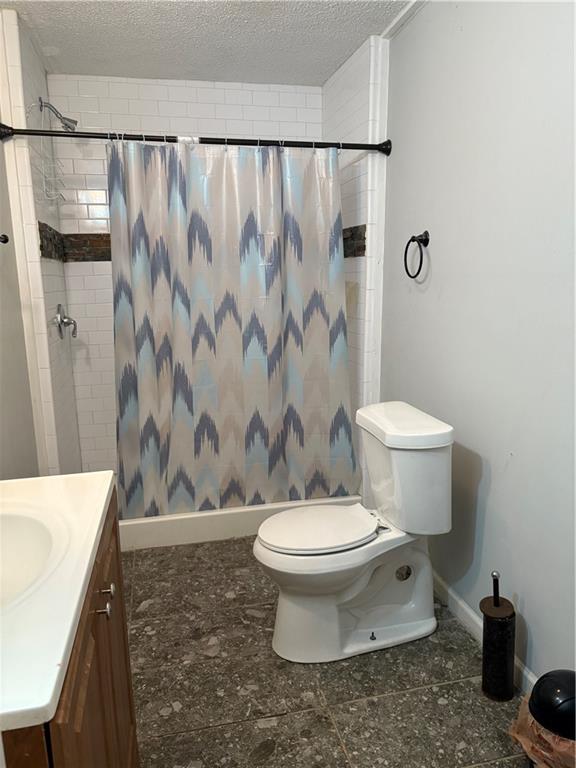 343 Cairo Street Northwest Atlanta, GA 30314 - Photo 7 of 13 a bathroom with a toilet and a sink