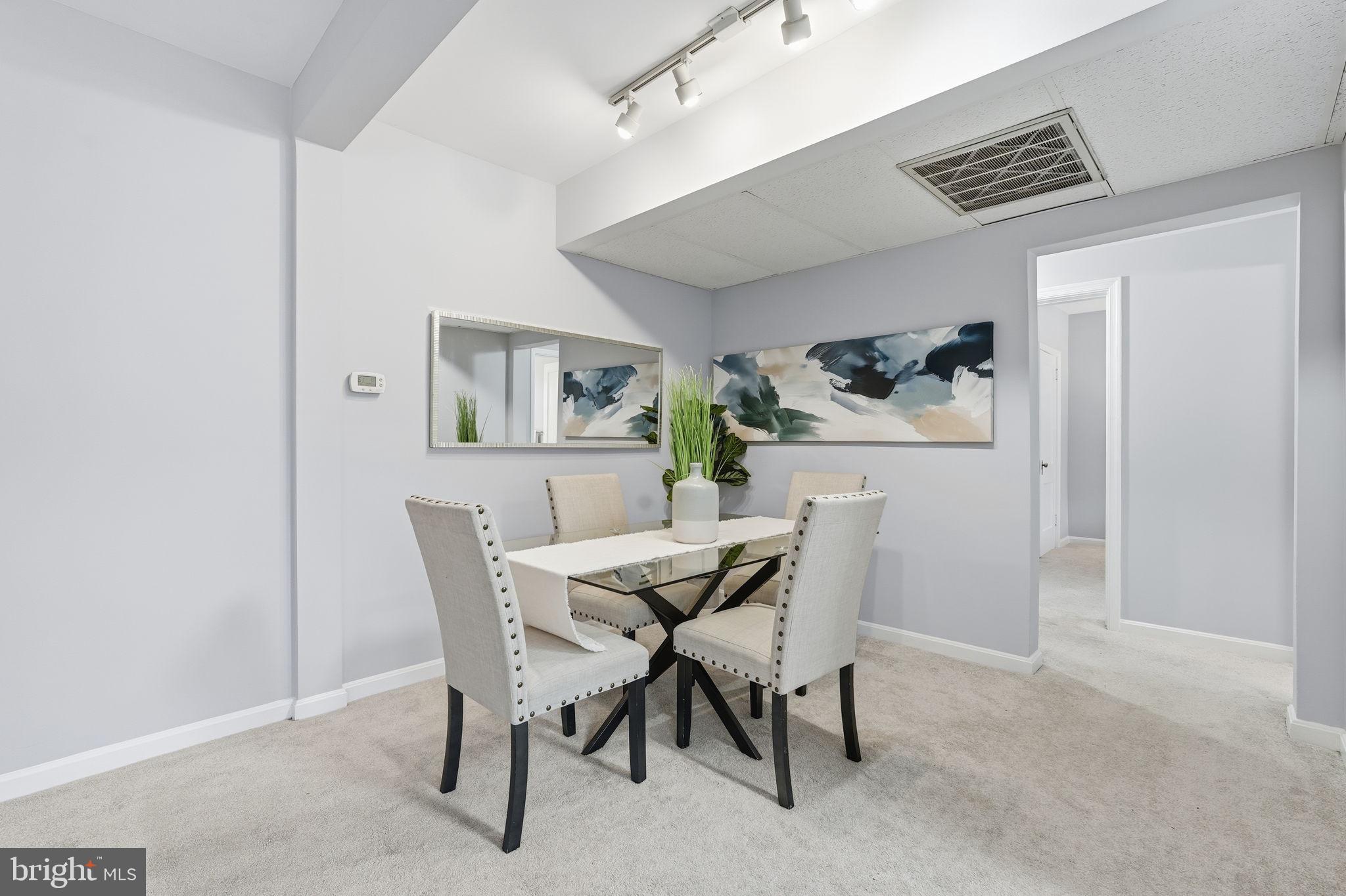1909 North Rhodes Street, Unit 30 Arlington, VA 22201 - Photo 3 of 14 a view of a dining room with furniture