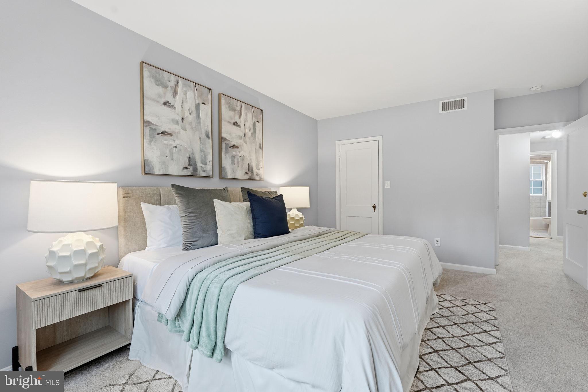 1909 North Rhodes Street, Unit 30 Arlington, VA 22201 - Photo 8 of 14 a bedroom with a bed and a night stand