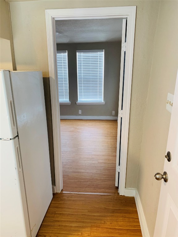 2304 South 1st Street, Unit C Austin, TX 78704 - Photo 21 of 26 a view of a hallway with wooden floor and staircase