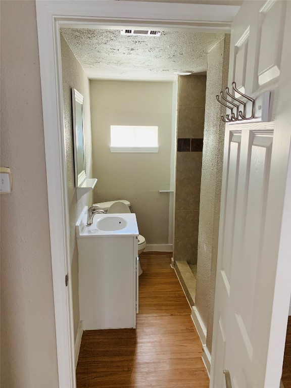 2304 South 1st Street, Unit C Austin, TX 78704 - Photo 24 of 26 a bathroom with a sink a mirror and shower