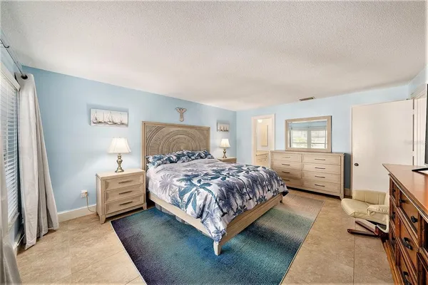 a bedroom with a bed and a cabinets
