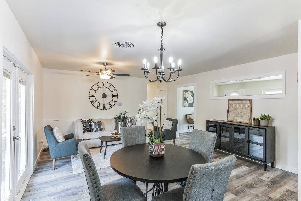 5200 Old Manor Road Austin, TX 78723 - Photo 1 of 1 a view of a dining room with furniture a chandelier and wooden floor