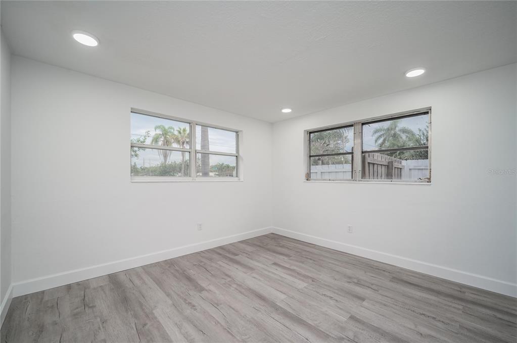 3409 Corey Road Sarasota, FL 34232 - Photo 12 of 19 an empty room with wooden floor and window