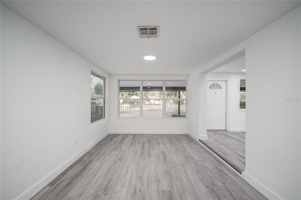 3409 Corey Road Sarasota, FL 34232 - Photo 6 of 19 wooden floor in an empty room with a window