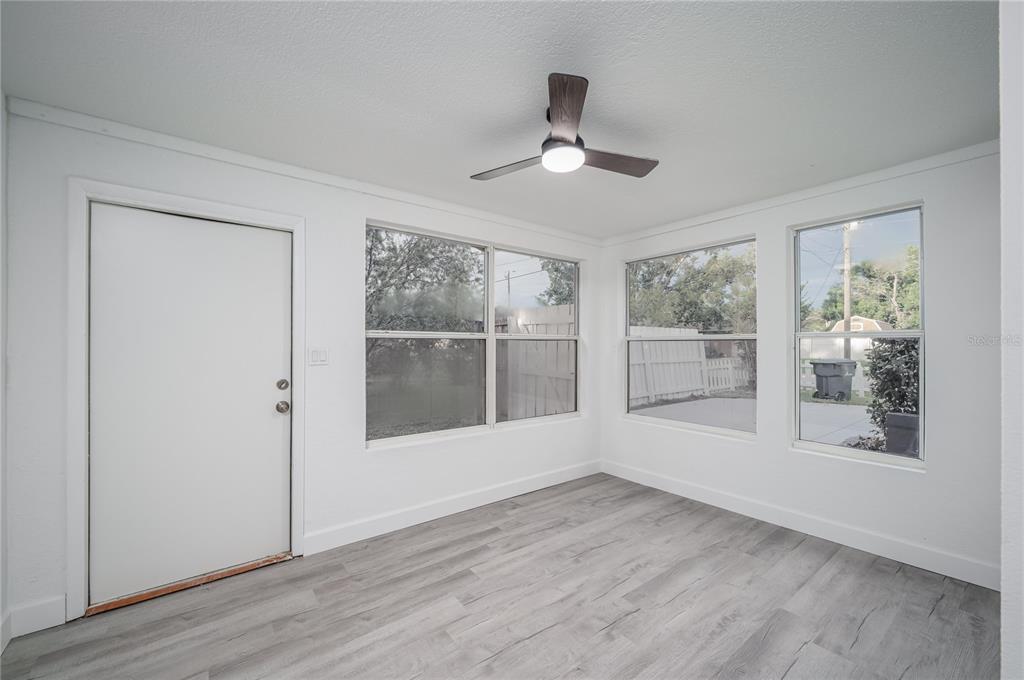 3409 Corey Road Sarasota, FL 34232 - Photo 7 of 19 a view of empty room with wooden floor and fan