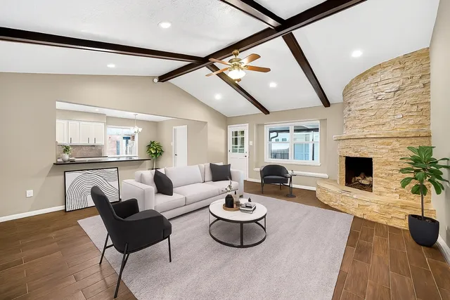 a living room with furniture and a fireplace