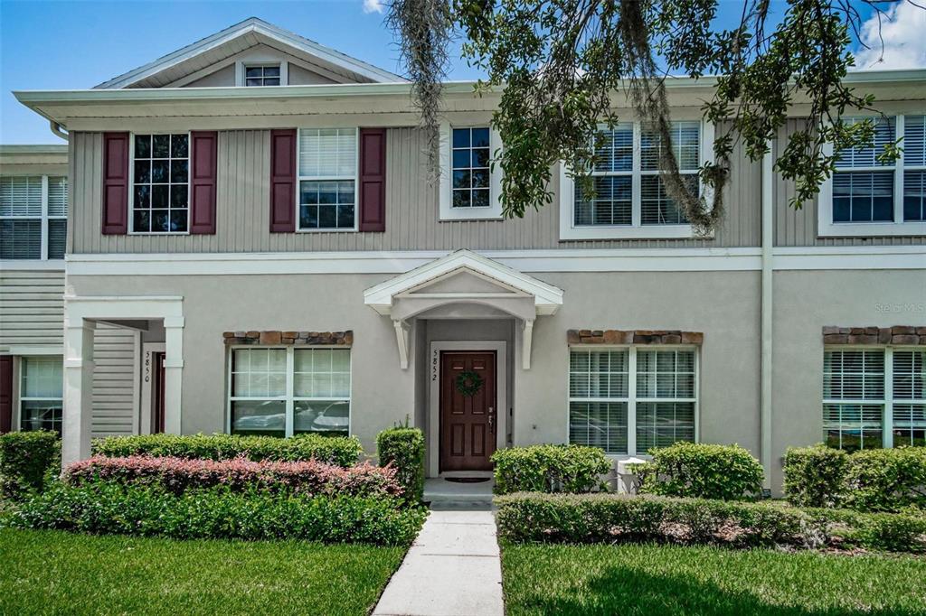 5852 Fishhawk Ridge Drive Lithia, FL 33547 - Photo 1 of 1 front view of a brick house with a yard