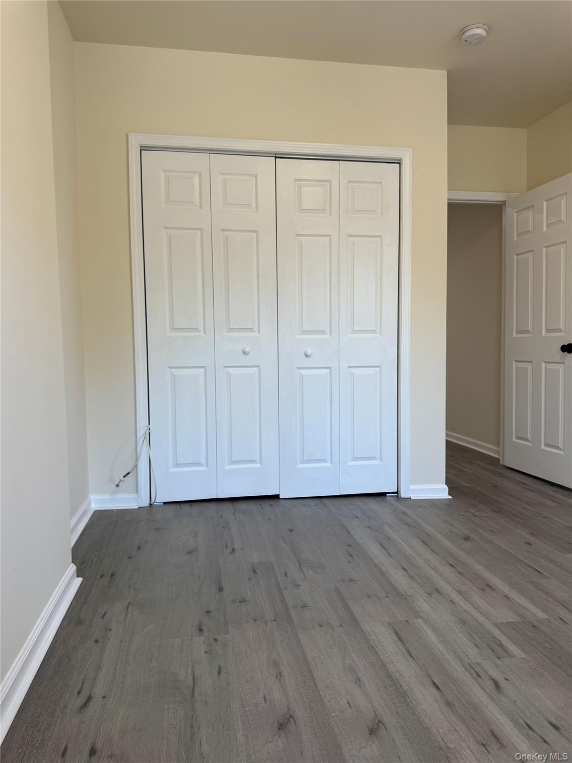 167 Main Street, Unit 2 Beacon, NY 12508 - Photo 16 of 19 a view of an empty room with wooden floor