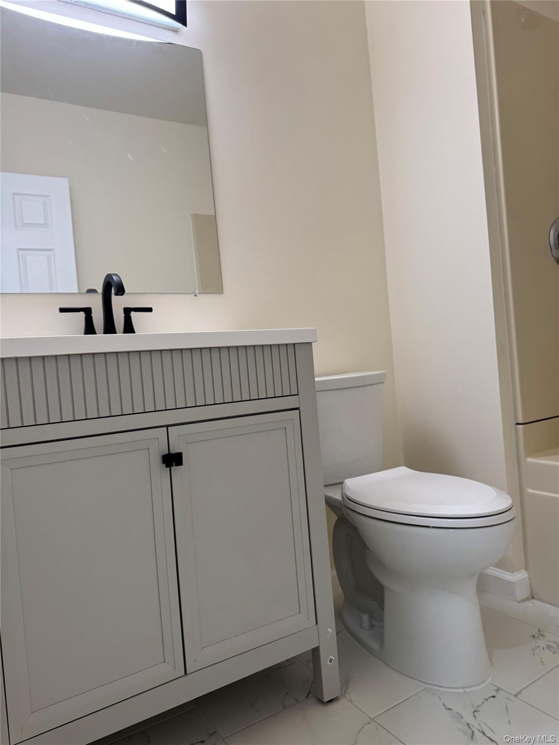 167 Main Street, Unit 2 Beacon, NY 12508 - Photo 19 of 19 a bathroom with a toilet and a sink