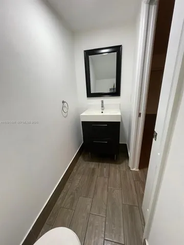 a bathroom with a sink and mirror