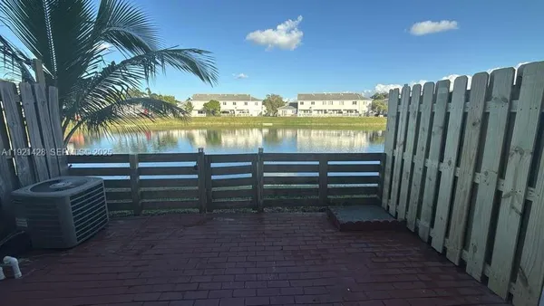 a view of a balcony with furniture