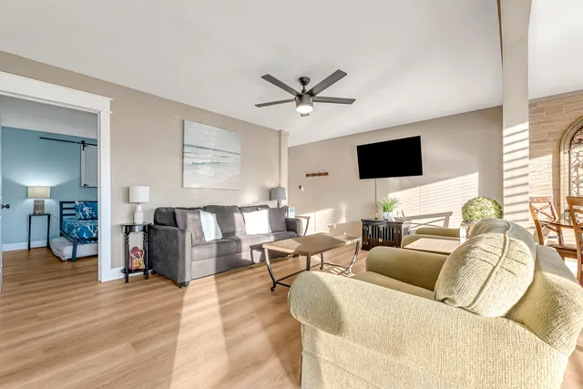 a living room with furniture and a flat screen tv