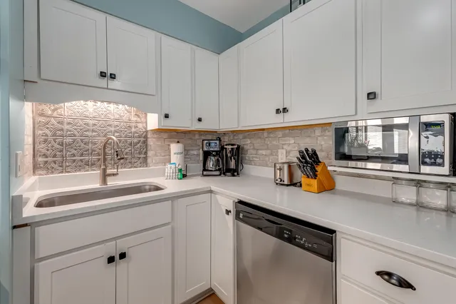 a kitchen with sink cabinets and window