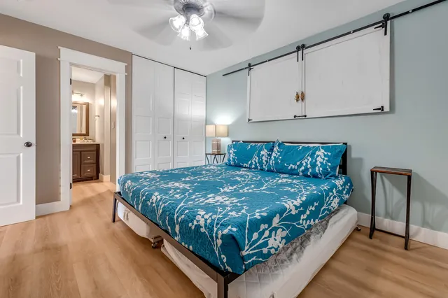 a large bedroom with bed and window