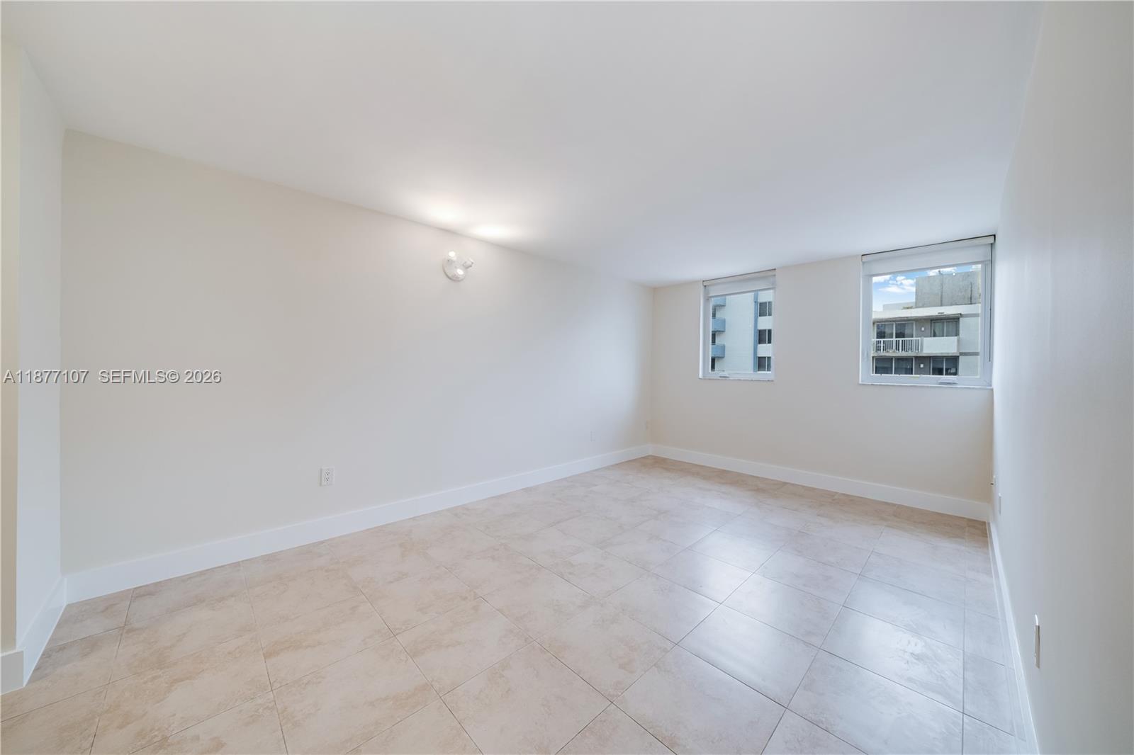 1665 Bay Road, Unit 521 Miami Beach, FL 33139 - Photo 14 of 25 a view of an empty room with a window