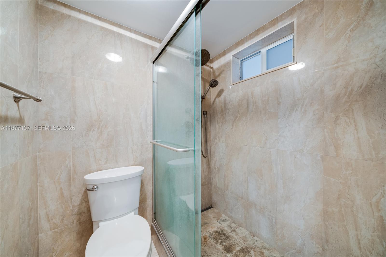 1665 Bay Road, Unit 521 Miami Beach, FL 33139 - Photo 17 of 25 a bathroom with a toilet and a shower