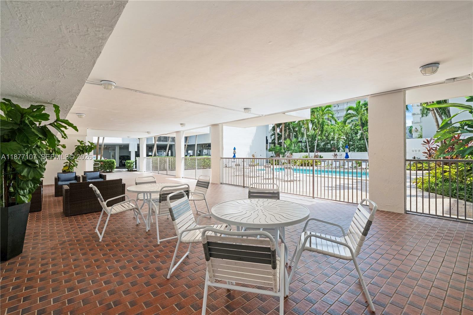 1665 Bay Road, Unit 521 Miami Beach, FL 33139 - Photo 21 of 25 a dining room with furniture window and wooden floor