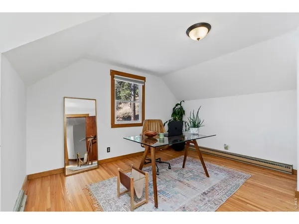 a workspace with furniture and a potted plant