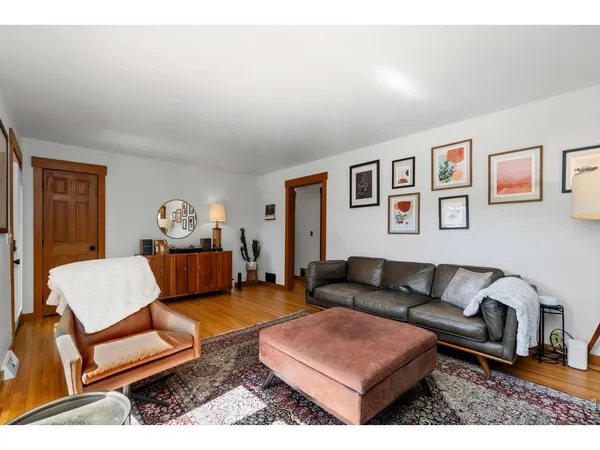a spacious bathroom with a granite countertop sink mirror and window