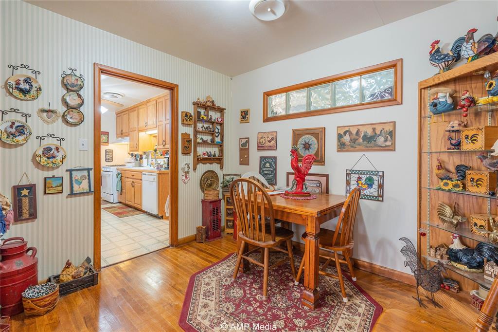 704 East Burnside Street Rotan, TX 79546 - Photo 12 of 31 a view of a dining room with furniture a rug and wooden floor