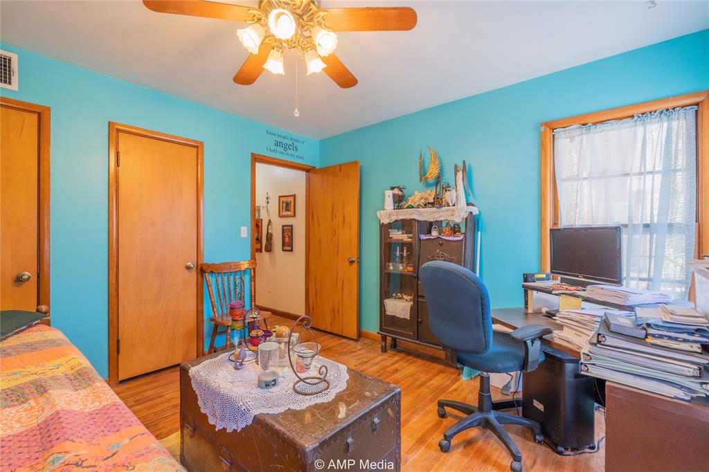 704 East Burnside Street Rotan, TX 79546 - Photo 15 of 31 a workspace with furniture and a chandelier