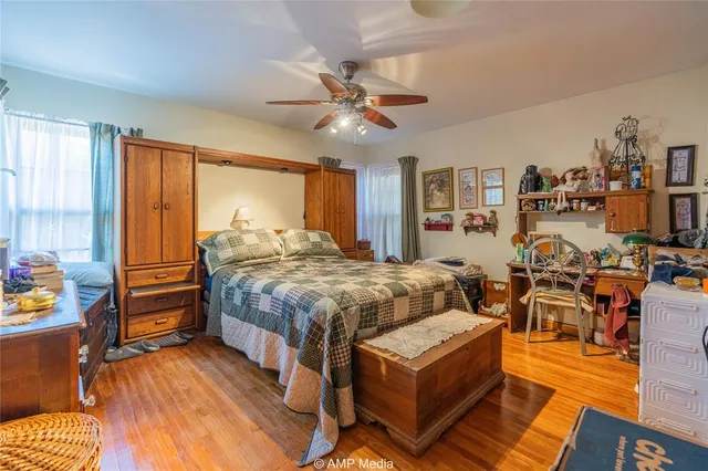 a bed room with a bed and a chandelier