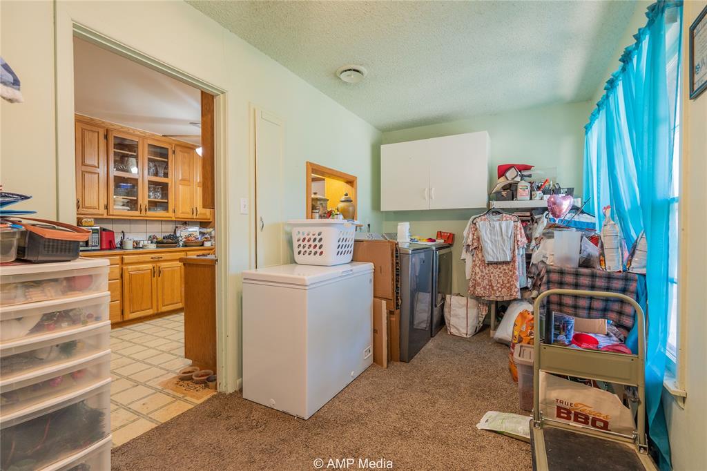 704 East Burnside Street Rotan, TX 79546 - Photo 23 of 31 a view of a storage & utility room