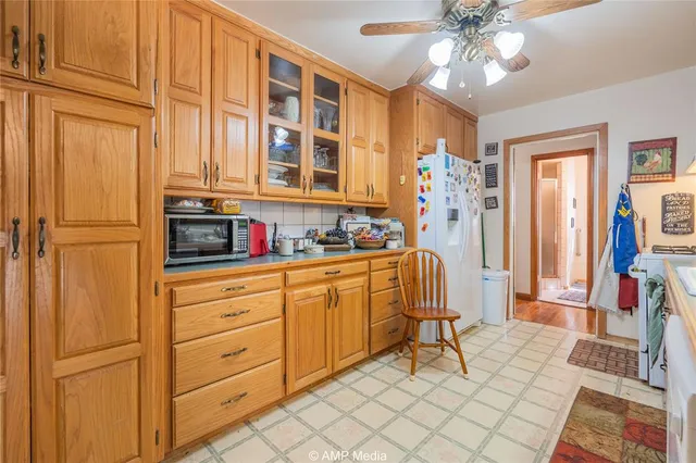 a kitchen with stainless steel appliances granite countertop a refrigerator and a stove