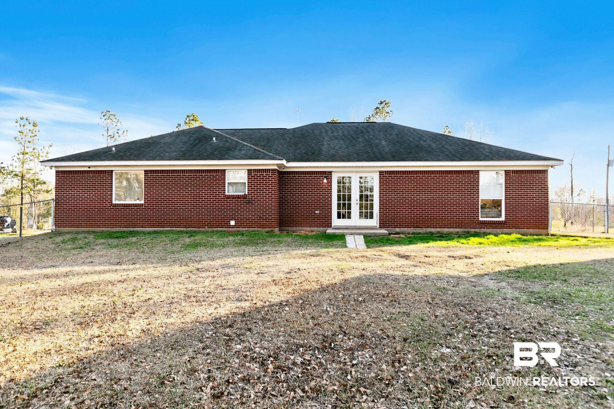 55750 Lottie Road Perdido, AL 36562 - Photo 35 of 84 Rear view of property featuring french doors, brick siding, and a shingled roof