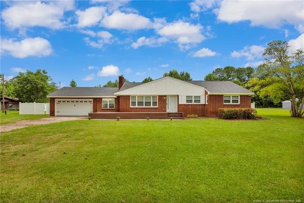 a view of a house with a big yard