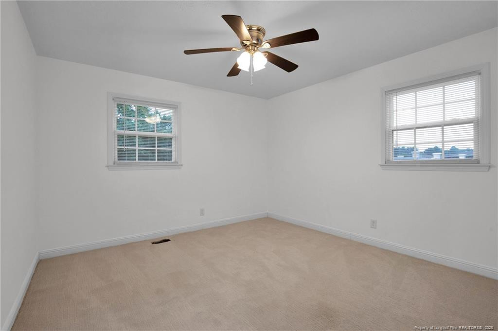 309 Cornith Road Pembroke, NC 28372 - Photo 28 of 40 an empty room with a window and a ceiling fan