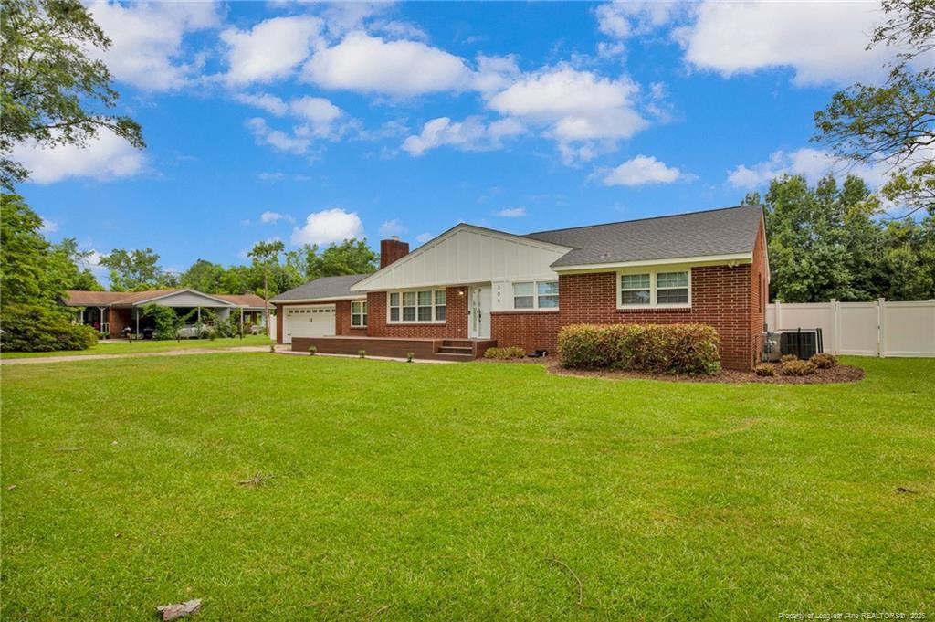 309 Cornith Road Pembroke, NC 28372 - Photo 3 of 40 a front view of a house with garden