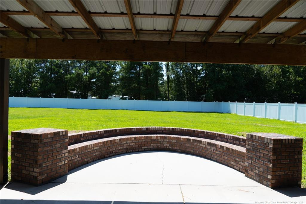 309 Cornith Road Pembroke, NC 28372 - Photo 34 of 40 a view of a swimming pool with a yard