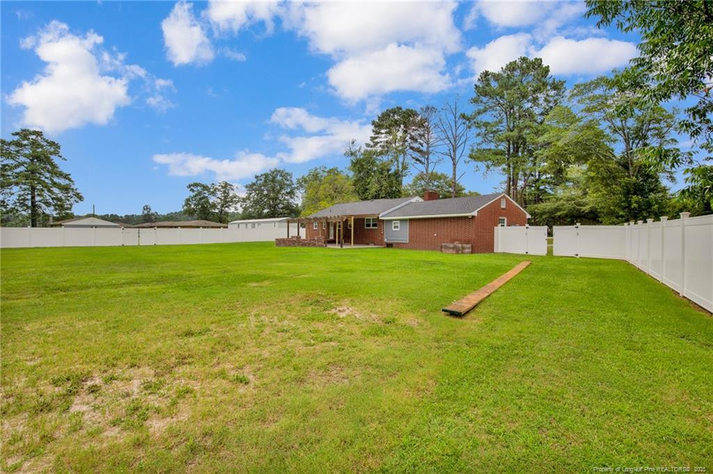 309 Cornith Road Pembroke, NC 28372 - Photo 37 of 40 a view of yard with swimming pool and green space