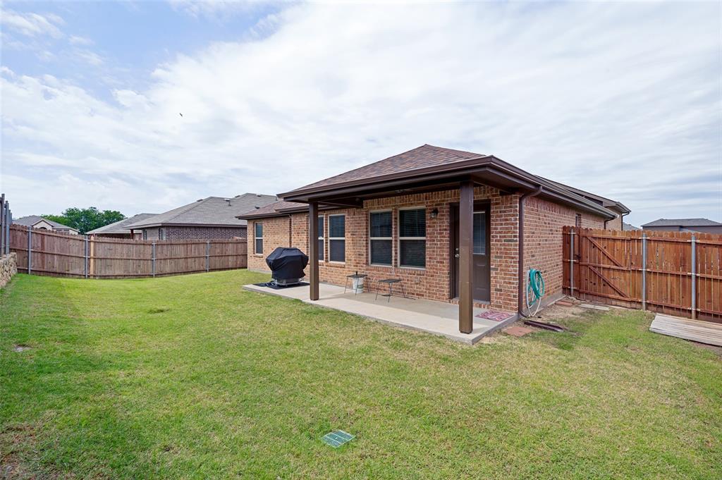 3905 Bridle Path Lane Sanger, TX 76266 - Photo 23 of 26 a view of a house with a yard and sitting area