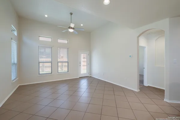 a view of an empty room with a window
