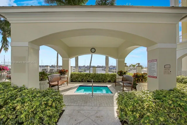 a room with furniture pool table and windows