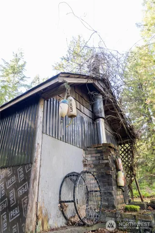 a view of a yard with plants and trees