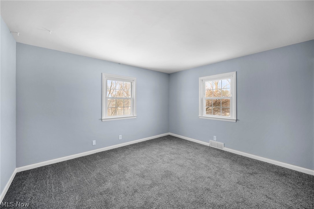 2099 Pontius Road Mogadore, OH 44260 - Photo 14 of 35 Carpeted bedroom with natural light