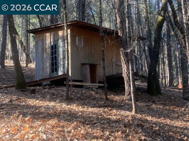 9471 Wildcat Road Kelseyville, CA 95451 - Photo 4 of 14 a front view of a house with a yard