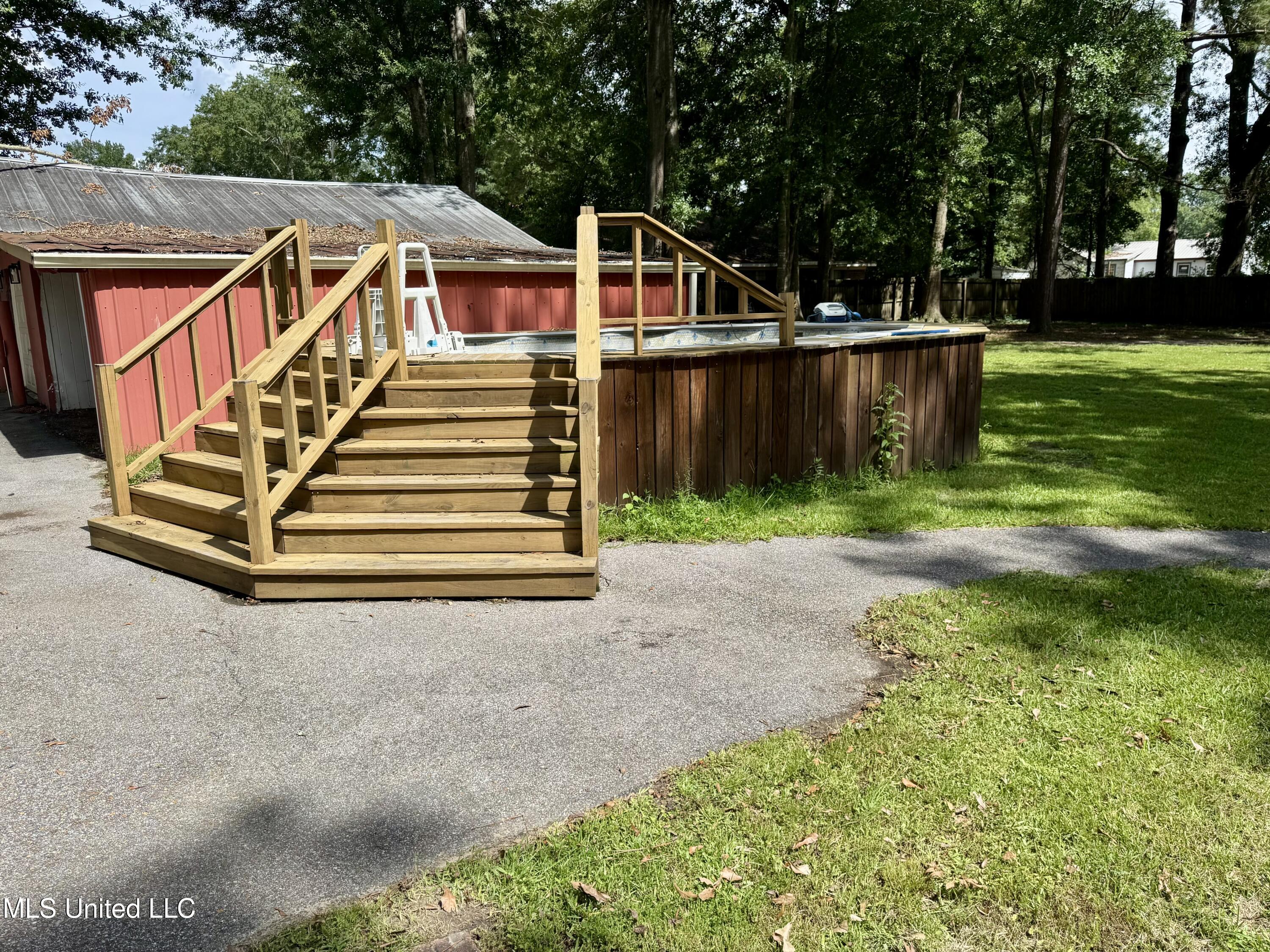 214 East Church Street Quitman, MS 39355 - Photo 17 of 22 Above ground pool with deck surround