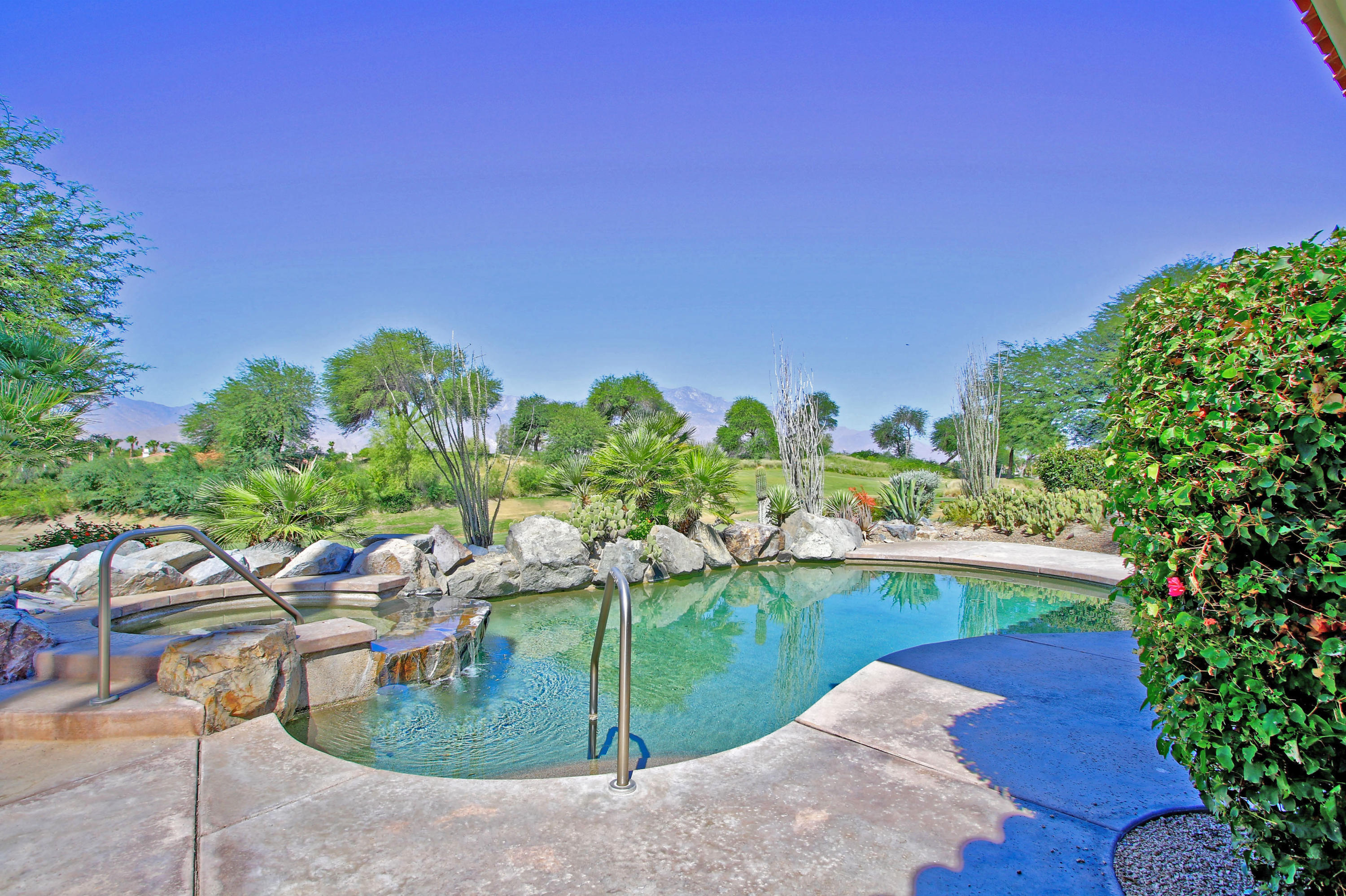 198 Loch Lomond Road Rancho Mirage, CA 92270 - Photo 2 of 5 a view of a swimming pool with a patio