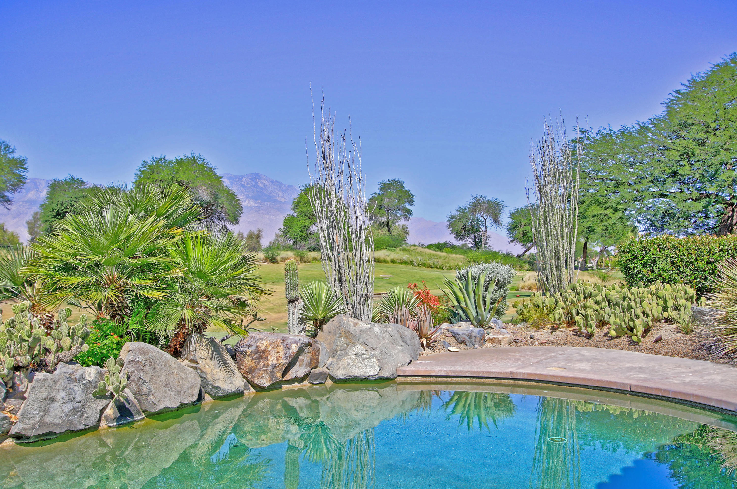 198 Loch Lomond Road Rancho Mirage, CA 92270 - Photo 5 of 5 a view of a lake with a park
