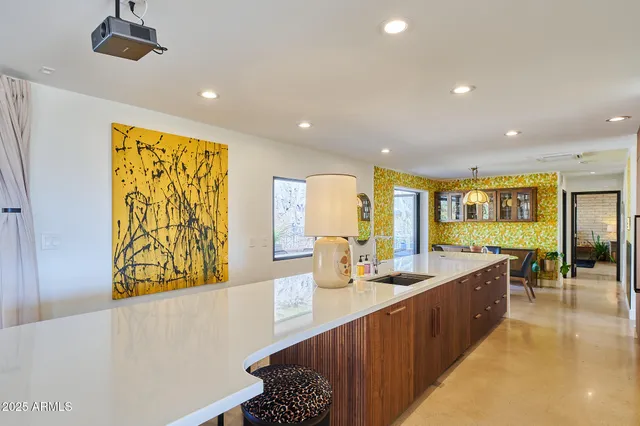 a kitchen with stainless steel appliances granite countertop a stove and a refrigerator