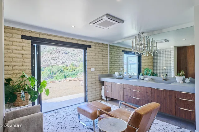a spacious bathroom with a granite countertop tub sink and mirror
