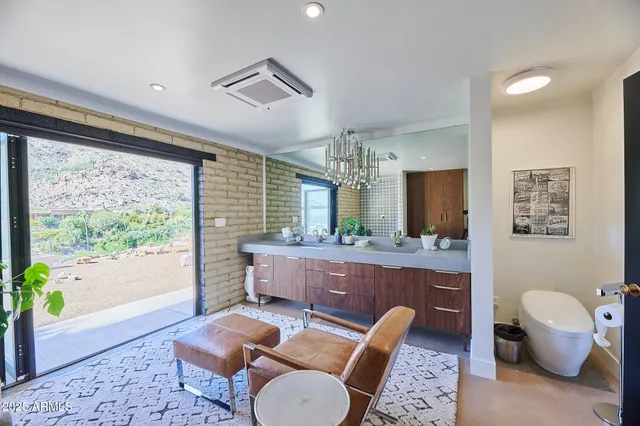 a bedroom with a large bed and a large window