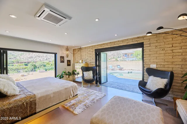 a large bathroom with a double vanity sink a mirror and a bathtub
